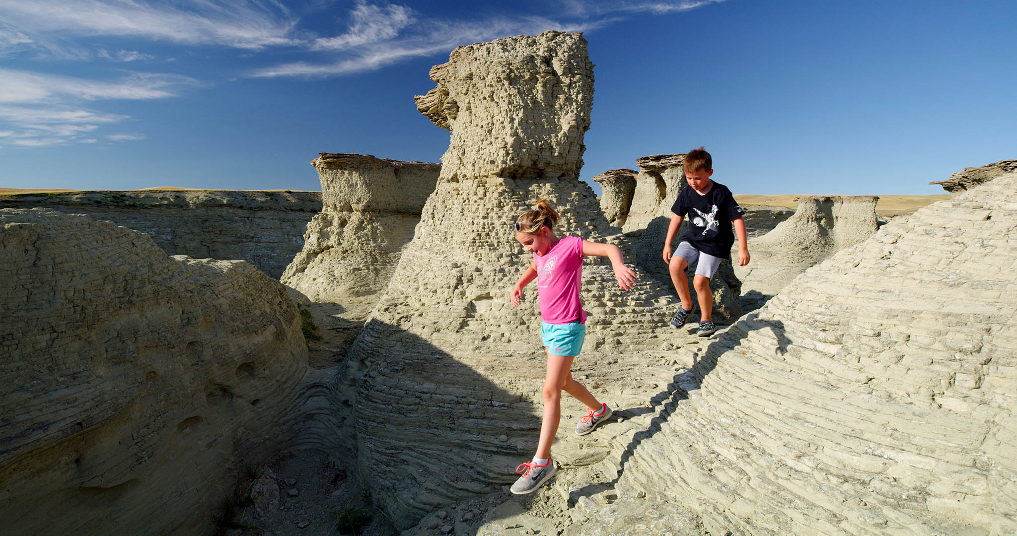Children playing outside in the sandstone formations