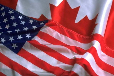 Overlap of Canadian and American flags